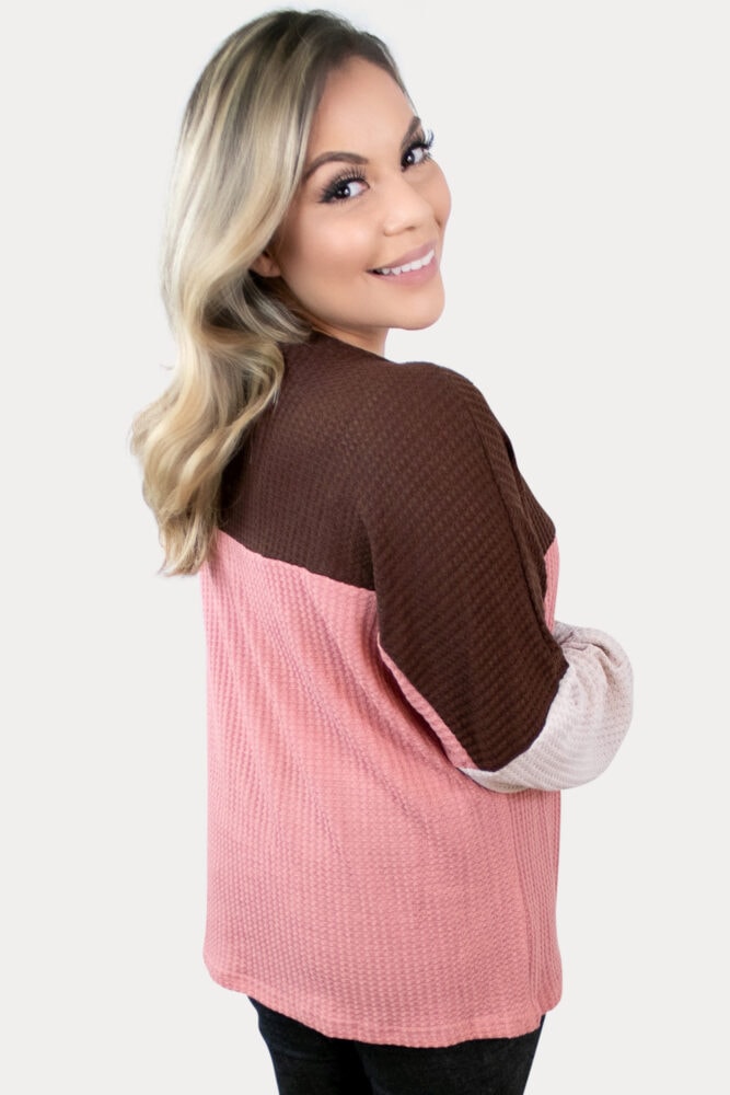 Fun, and cozy, this waffle knit maternity top is sure to keep you comfy.