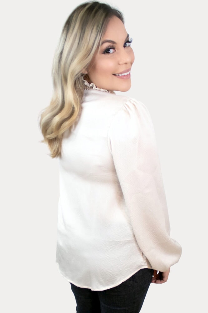 This stylish turtleneck maternity top is sure to impress in a stunning champagne color, flowy bell sleeves and ruffled neckline!